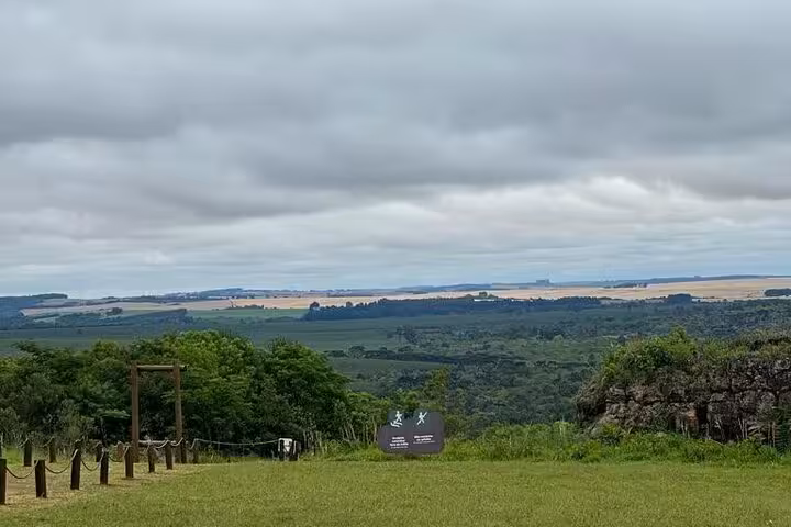 Panoramic view of rolling hills and fields at Vila Velha State Park, offering breathtaking landscapes for adventurers.
