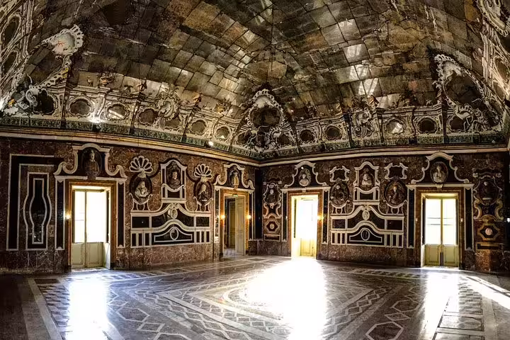 Ornate marble hall of Villa Palagonia in Bagheria, with intricate stucco decorations, on a private Palermo day tour