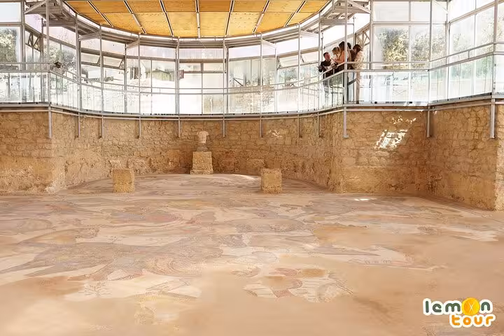 Spacious gallery showcasing preserved Roman mosaics at Villa Romana del Casale, a key Piazza Armerina attraction.
