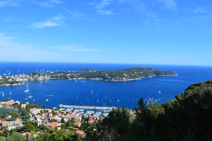 Aerial view of Villefranche-sur-Mer bay with sailboats and Cap Ferrat peninsula, French Riviera