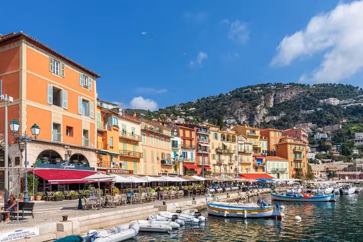 Colorful waterfront buildings and boats at Villefranche-sur-Mer harbor on the French Riviera