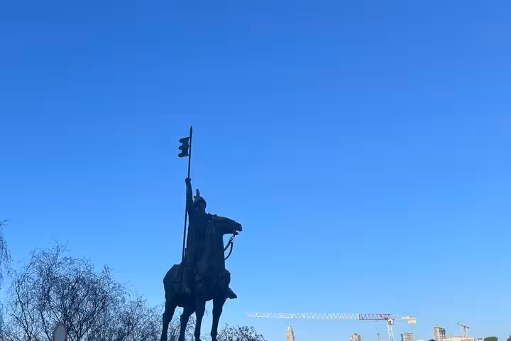 Silhouette of Vímara Peres equestrian statue against clear blue sky on a private history walking tour in Porto
