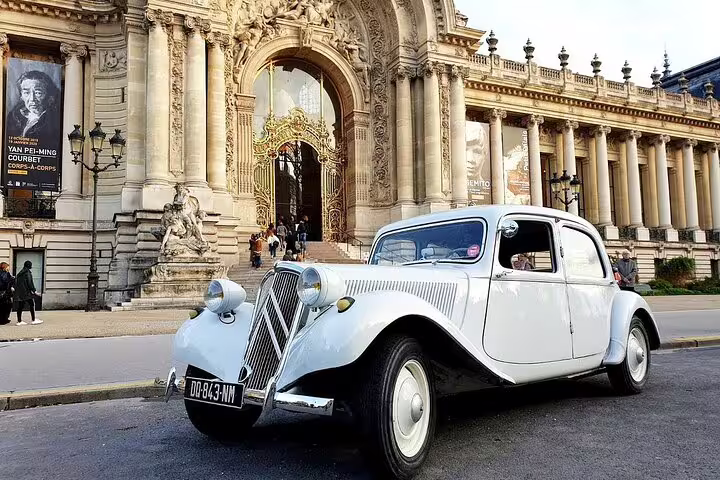 Vintage white Citroën Traction Avant parked in front of the Petit Palais in Paris