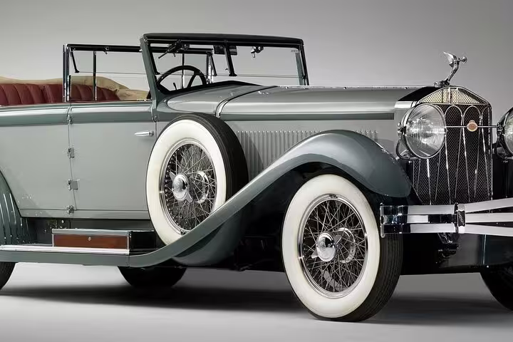 Classic 1930s vintage convertible car with white wall tires and chrome details