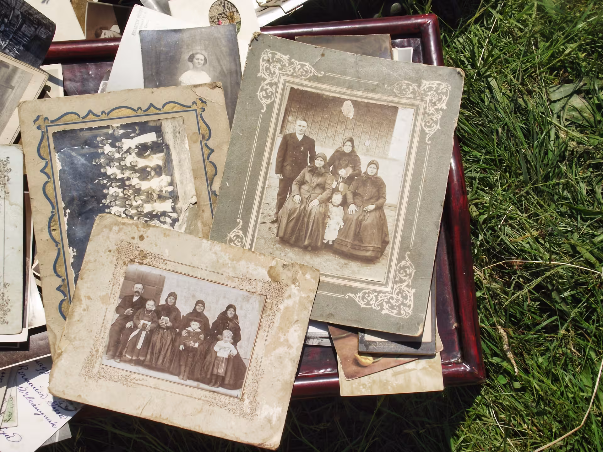Rare vintage family portrait photographs displayed at Negreni Flea Market antique stalls during guided tour
