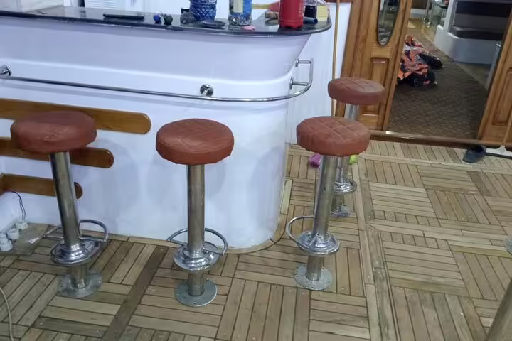 VIP boat bar area with stools onboard Samadai Dolphin House snorkeling trip from Marsa Alam, Red Sea