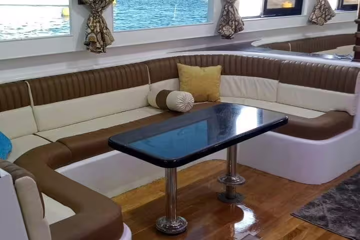 Spacious VIP boat salon with sea-view windows for Hamata Island snorkeling day trip, Marsa Alam Red Sea