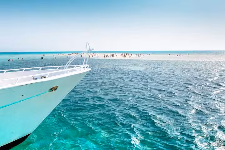 VIP boat approaches White Island sandbar near Ras Mohamed, Sharm El Sheikh with crystal-clear Red Sea