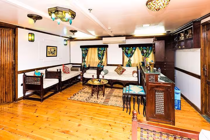 Elegant lounge and bar on VIP Dahabiya Nile cruise from Luxor to Aswan, 4 nights 5 days with seating