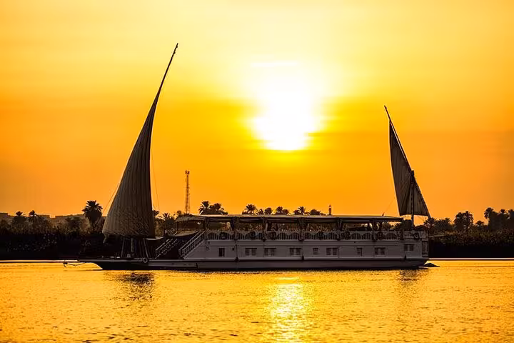 VIP Dahabiya sailing at sunset on the Nile, luxury 4-night cruise from Luxor to Aswan itinerary