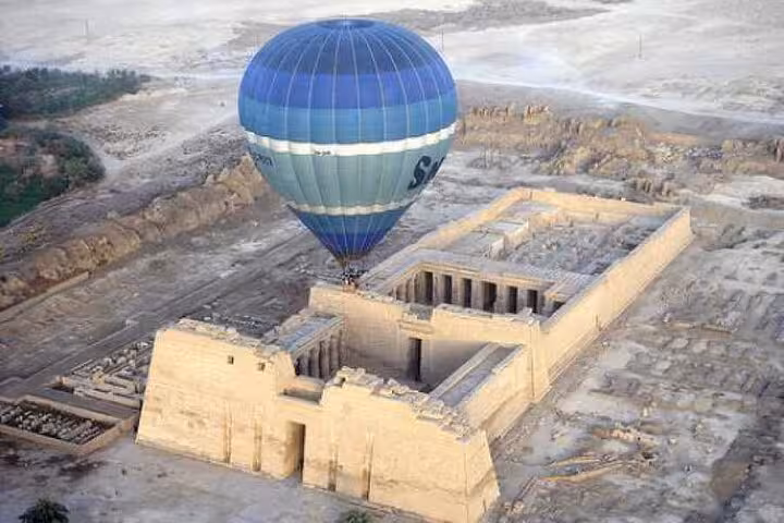 Hot air balloon flying over Hatshepsut Temple in Luxor, VIP sunrise ride with hotel transfers included
