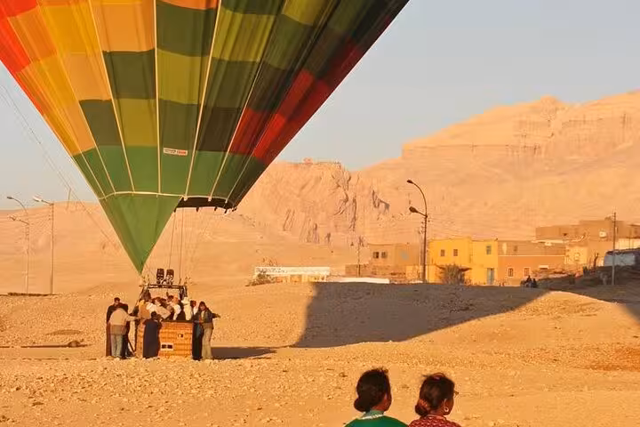 Guests boarding VIP Luxor hot air balloon at sunrise on the West Bank, with convenient pickup from all hotels