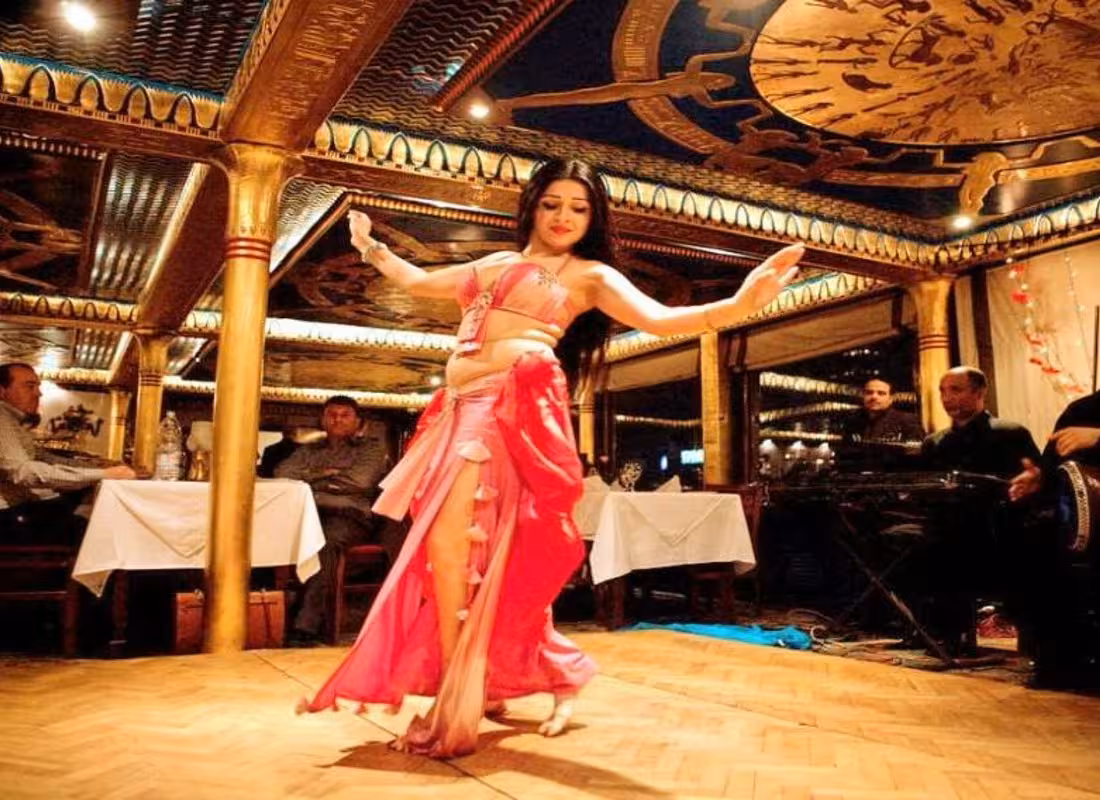 Belly dancer performing on a Cairo Nile River dinner cruise boat, VIP private dining with live Egyptian show