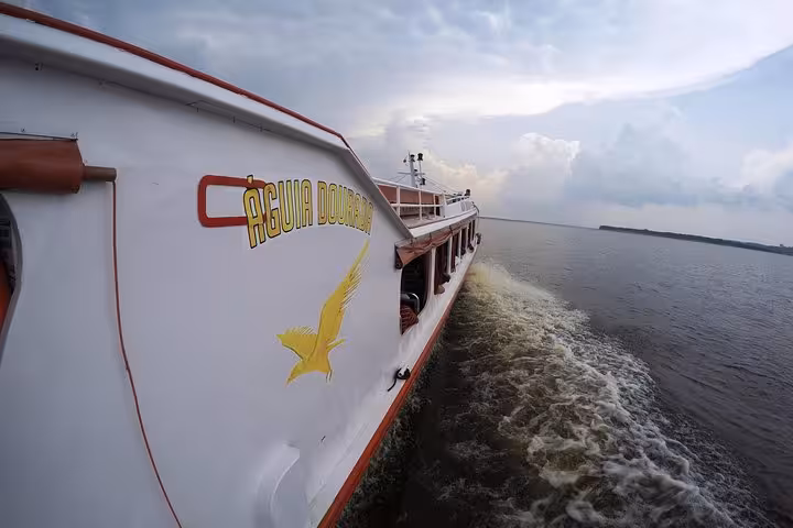 VIP speedboat cruising the Amazon River from Santa Rosa border to Iquitos Peru, fast river transfer