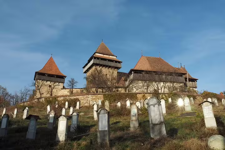 Viscri fortified church with medieval towers and historic cemetery in Transylvania, Romania
