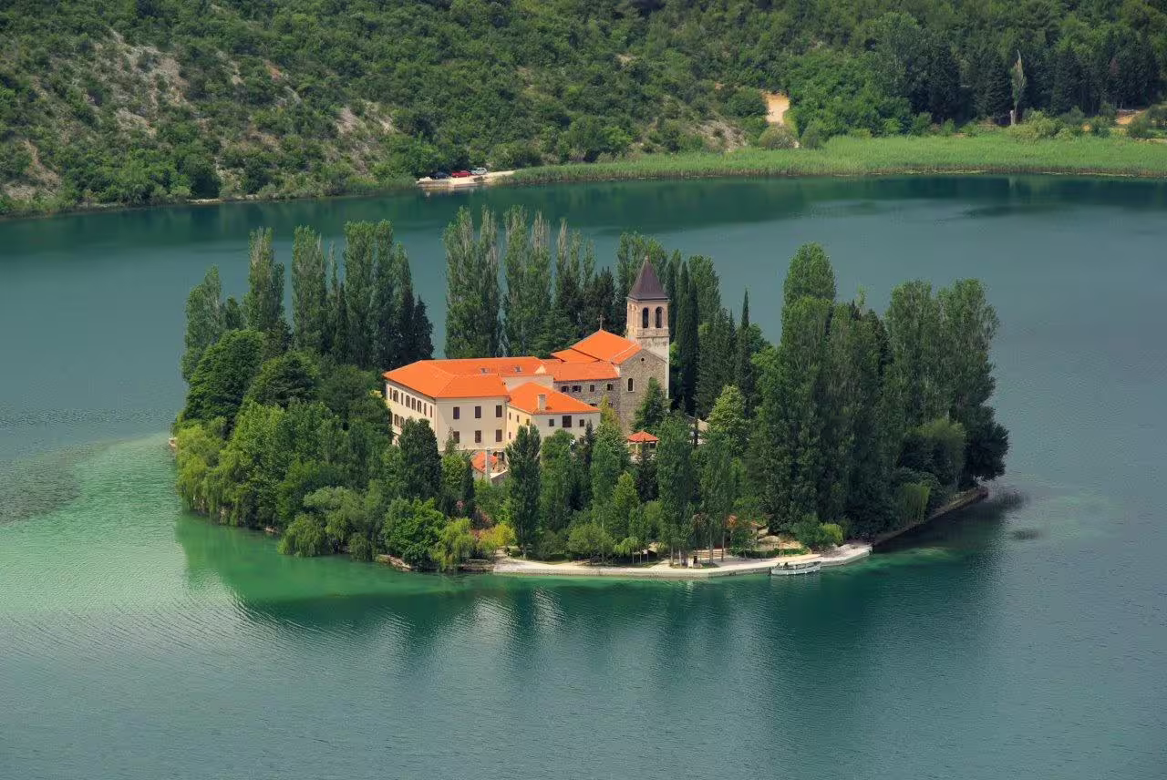 Visovac Monastery on a tiny island in Krka National Park, a highlight on Istria and Dalmatia self-drive tour