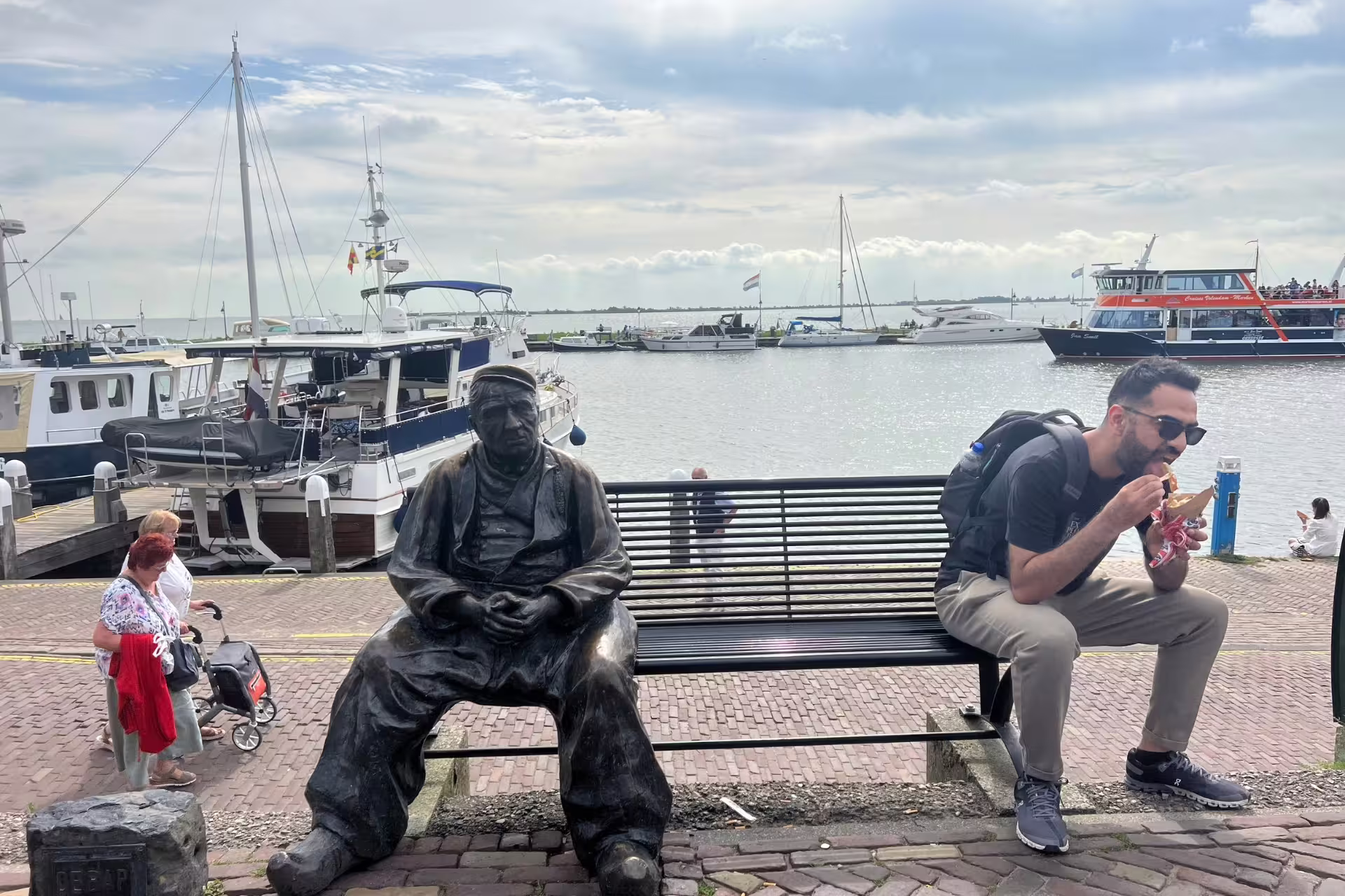 Volendam harbor stop on Amsterdam Zaanse Schans Volendam and Giethoorn tour, boats and waterfront views