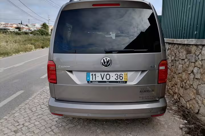 Rear view of spacious Volkswagen Caddy ideal for private transfer service in Faro, Albufeira, Seville, and Lisbon.