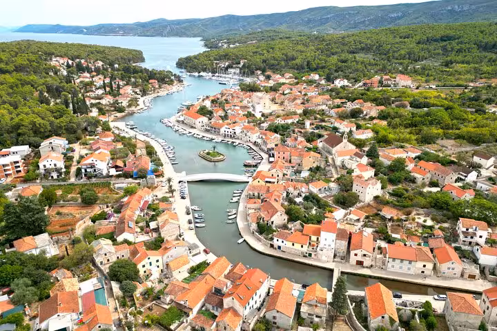 Aerial view of Vrboska harbor, Hvar Island, with stone bridge and marina on a private boat tour