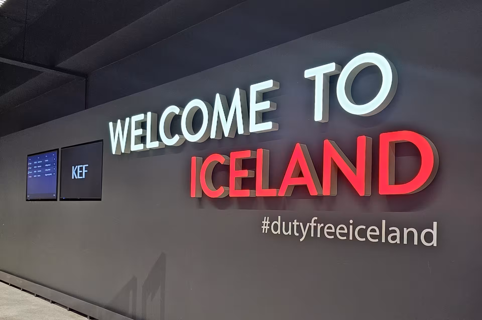Welcome to Iceland illuminated sign with #dutyfreeiceland hashtag at Keflavik Airport KEF arrival hall