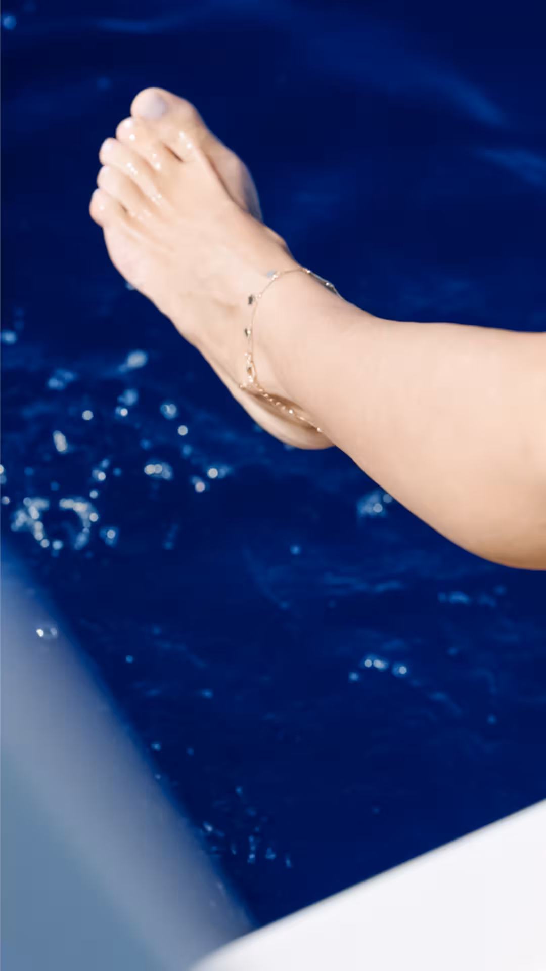 Barefoot sea dip from a yacht, sparkling blue water for Wellness & Sea Breeze coastal relaxation tour