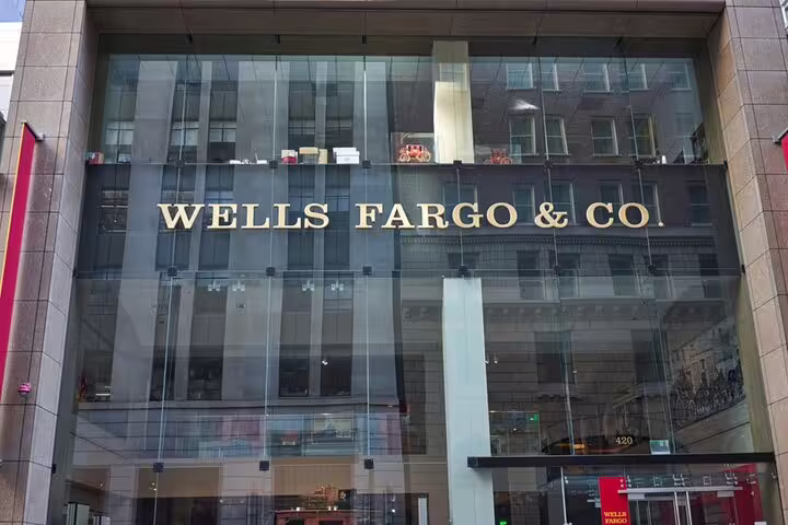Wells Fargo & Co. building facade with gold lettering on glass exterior in San Francisco