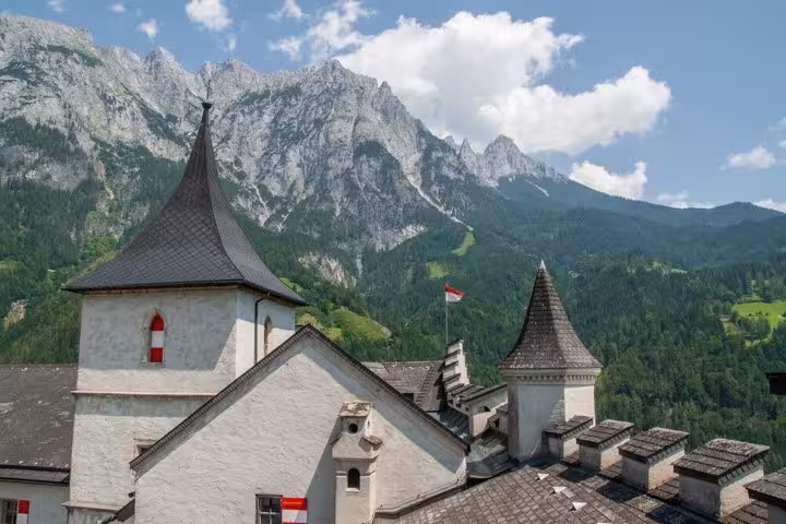Werfen Castle towers with Austrian Alps backdrop, stop on Eagles Nest and Hohenwerfen private day tour from Munich