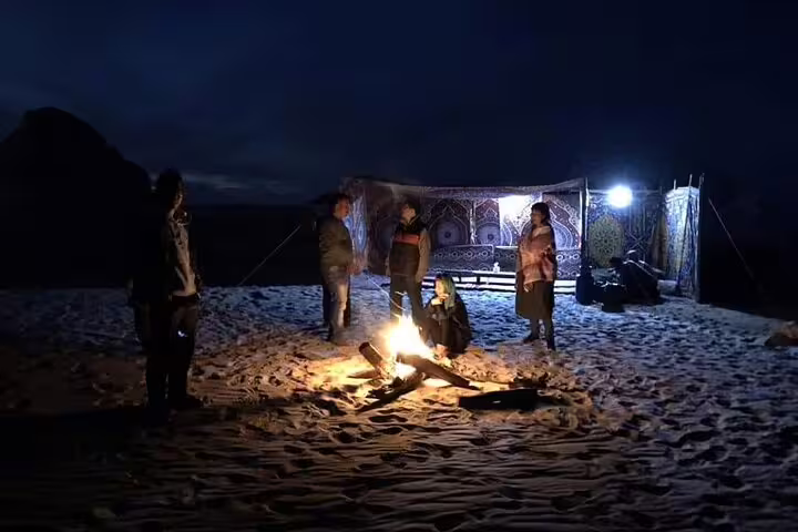 Night campfire in Egypt White Desert with Bedouin tent, part of private 4-day Bahariya Oasis safari tour