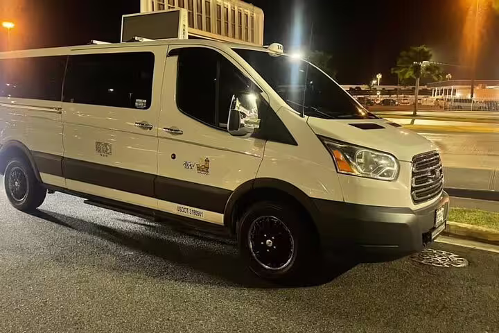 White Ford Transit van parked at night ready for Nassau Cruise Port private transfer to Nassau hotels