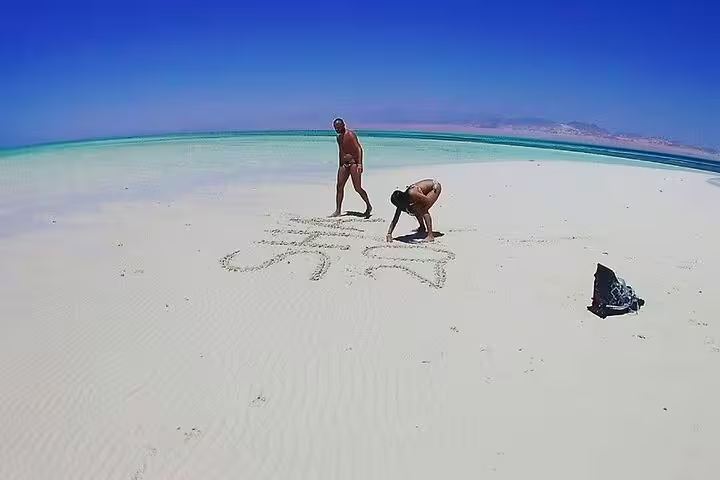 Guests on White Island near Ras Mohamed during VIP boat snorkeling day trip from Sharm El Sheikh, Red Sea