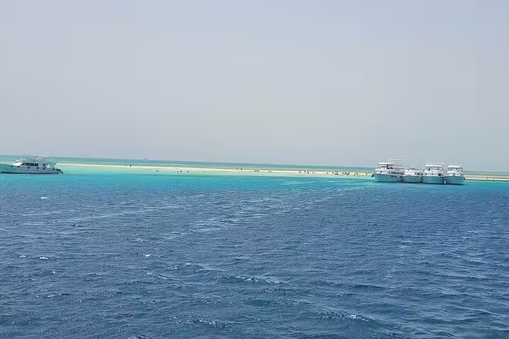 White Island sandbar with anchored VIP boats, snorkeling stop on Sharm El Sheikh Ras Mohamed tour
