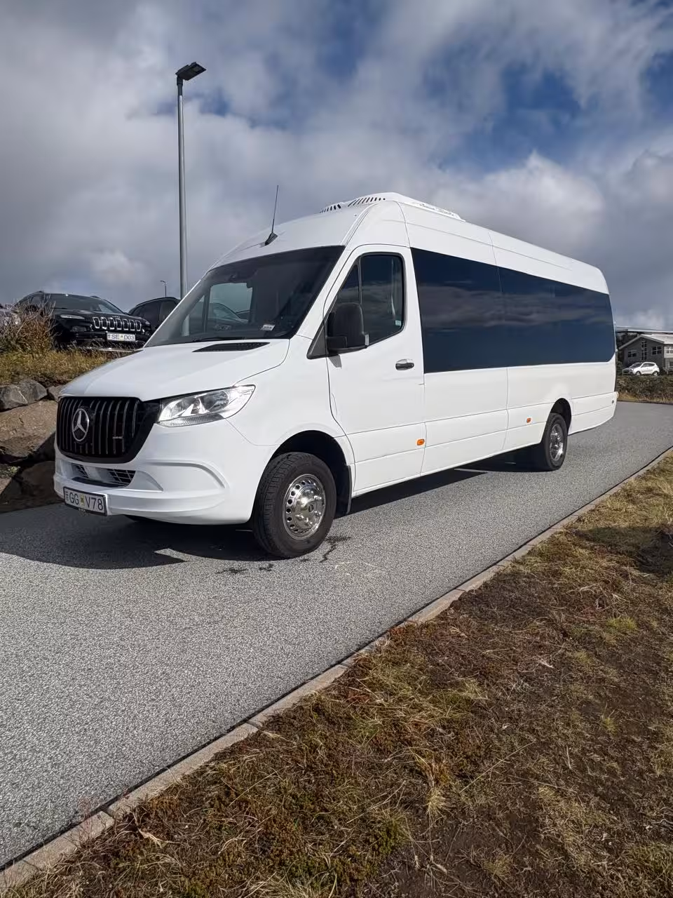 White Mercedes-Benz Sprinter minibus for private airport transfer service in Iceland