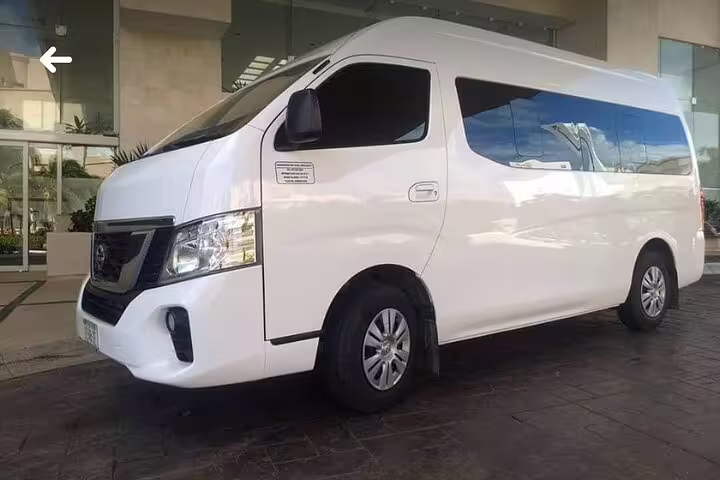 White Nissan van for private transfer from Dubai hotel to Dubai Airport DXB comfortable group ride