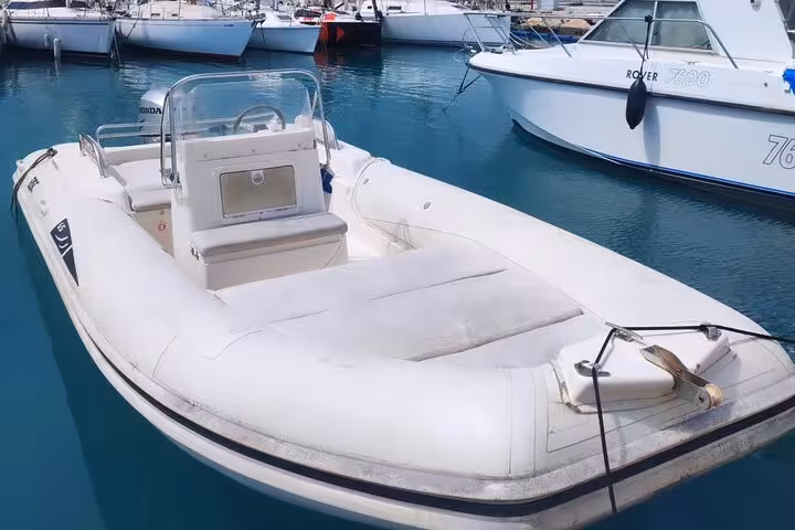 White RIB inflatable speedboat docked at Cannes marina on the French Riviera