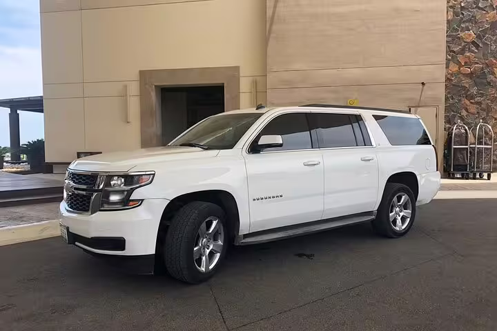White Chevrolet Suburban SUV for private transfer from Belize to Belize Airport BZE comfortable ride