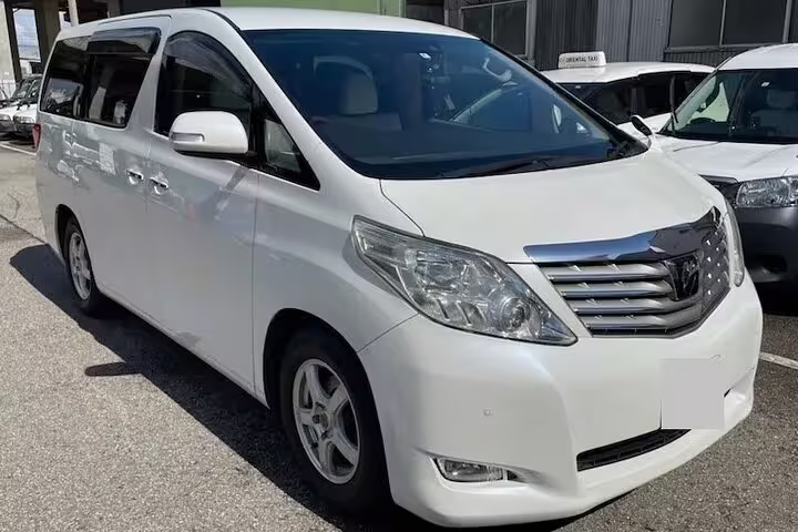 White Toyota Alphard minivan for private airport transfer service