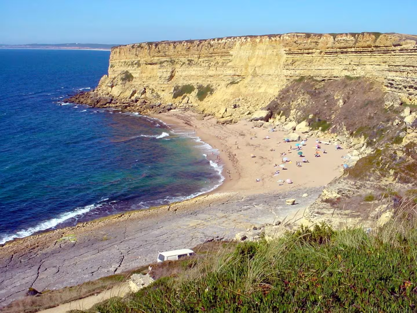 Wild West Coast cliff hike overlooking a sandy beach and turquoise Atlantic waters on a scenic coastal trek