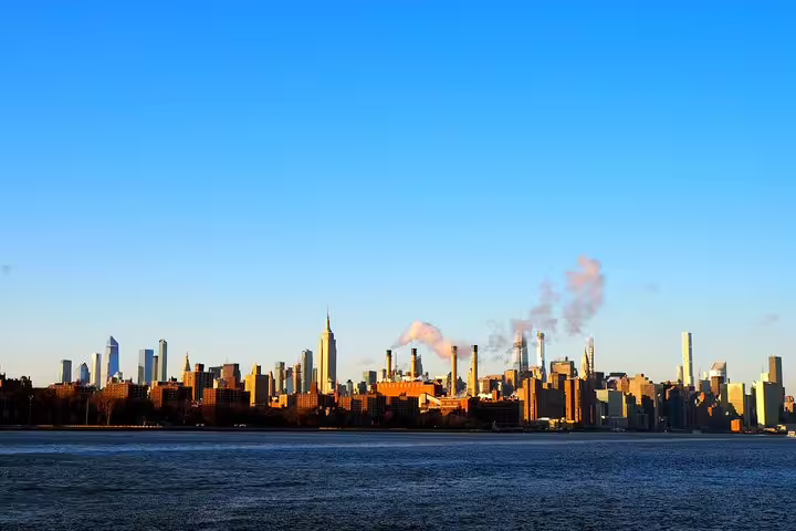 Manhattan skyline viewed from Williamsburg Brooklyn across the East River at golden hour
