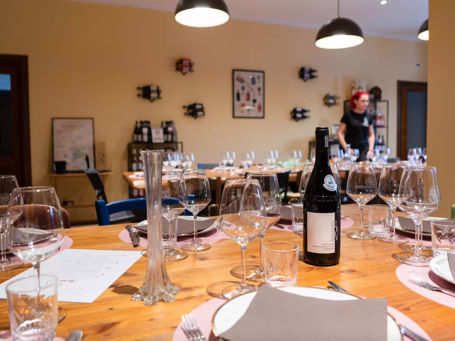 Elegant wine tasting setup with glasses and bottle in a cozy Asti winery, ideal for a Turin wine tour experience.