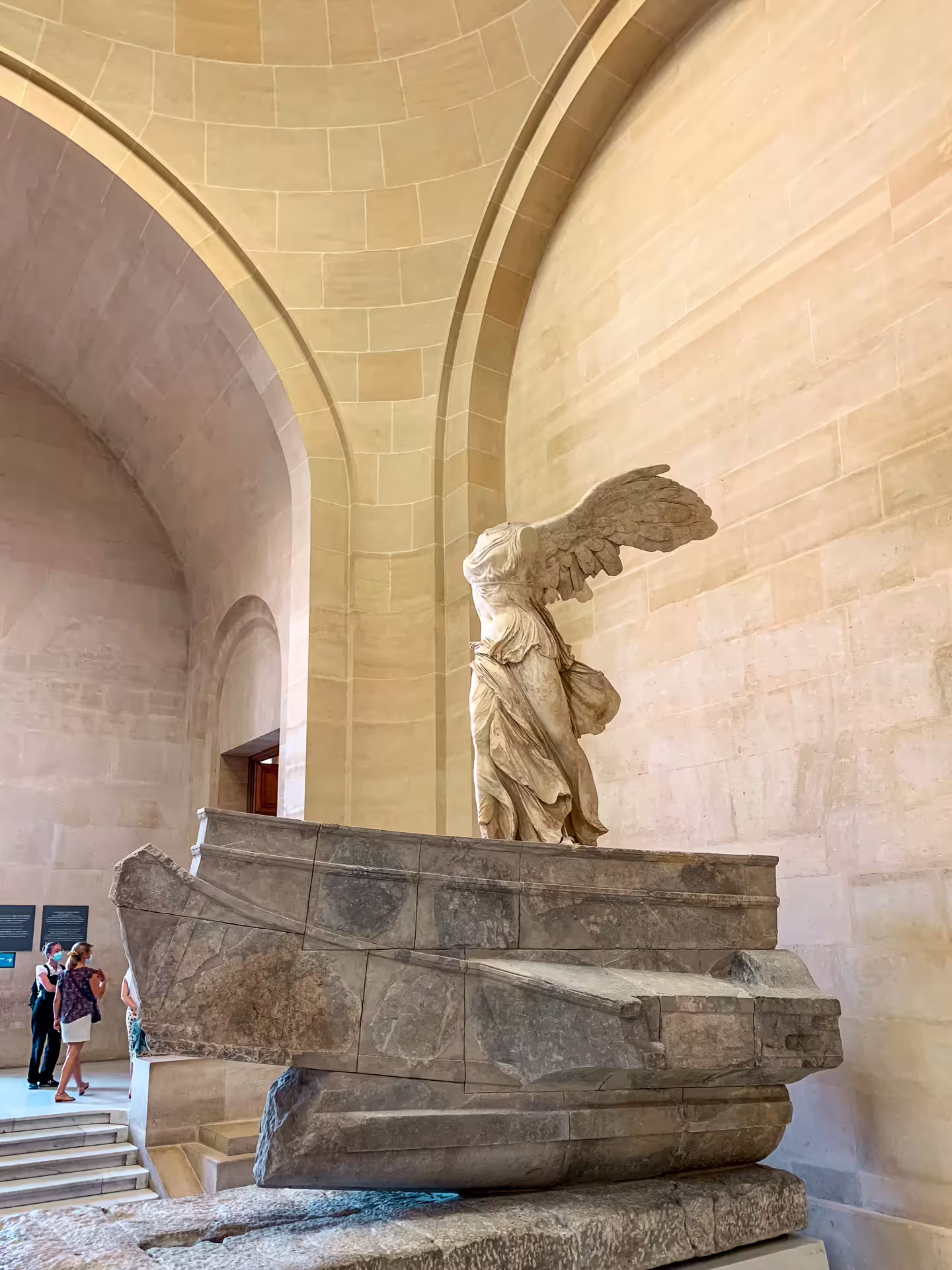 Winged Victory of Samothrace statue on ship prow pedestal at the Louvre Museum Paris