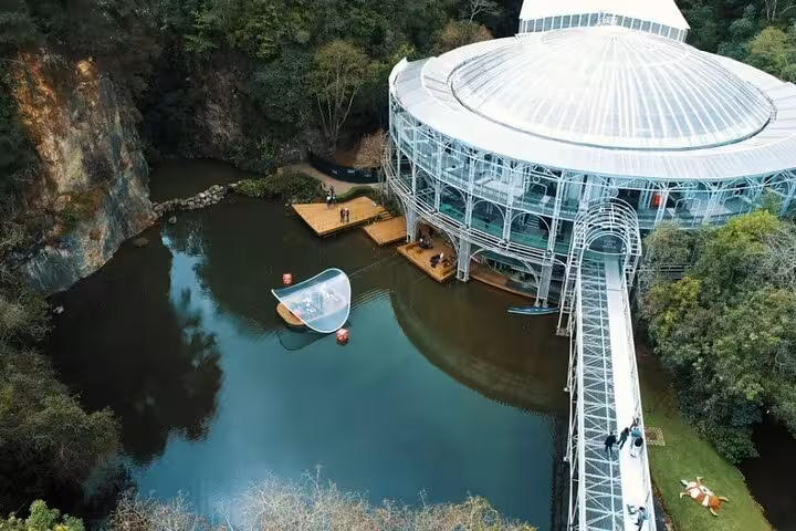 Visit the enchanting Wire Opera House set in lush greenery and tranquil waters during the Curitiba city tour.