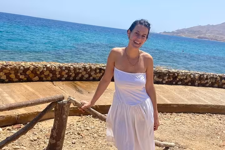 Woman by the turquoise Red Sea in Ain El Sokhna, relaxing on a Cairo to Sokhna day trip beach tour