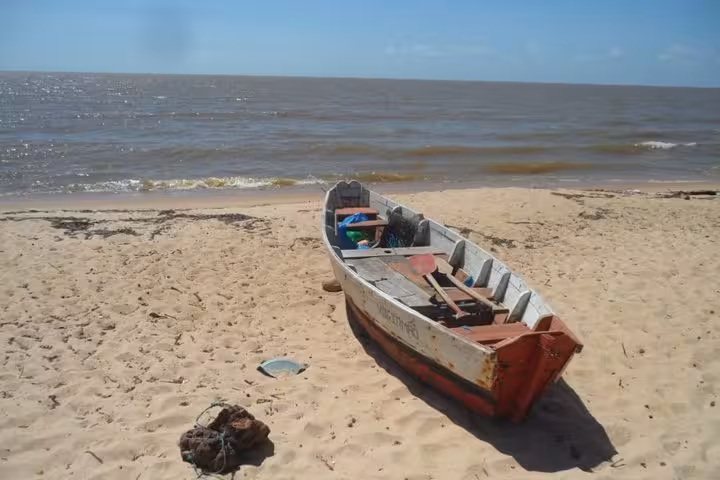 Traditional wooden fishing boat on Marajó Island beach, Amazon Delta stop on 3-day tour from Belém
