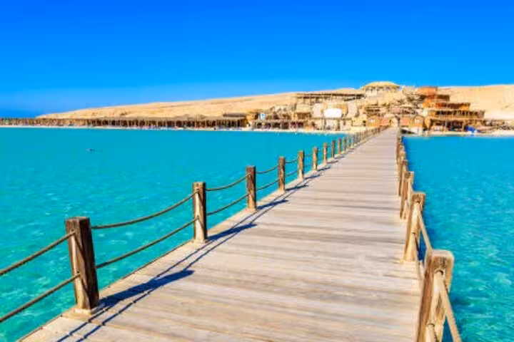 Wooden pier over turquoise Red Sea in Hurghada, scenic stop on snorkeling day trip from Luxor