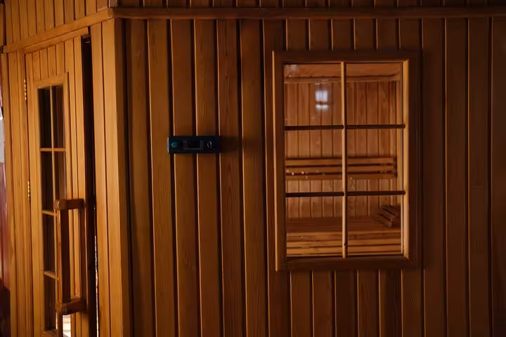 Wooden sauna cabin at Sharm El Sheikh royal hammam spa, part of a luxurious solo wellness experience
