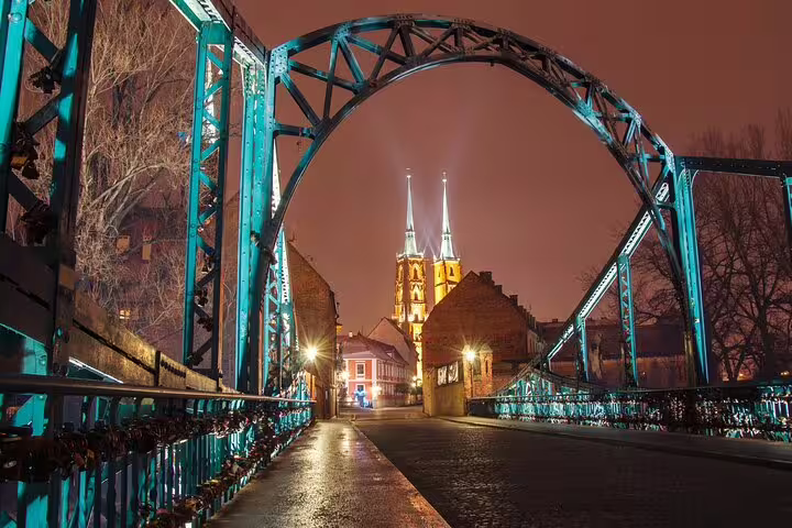 Night view on Wroclaw Tumski Bridge with illuminated cathedral towers, highlights for a self-guided scavenger hunt