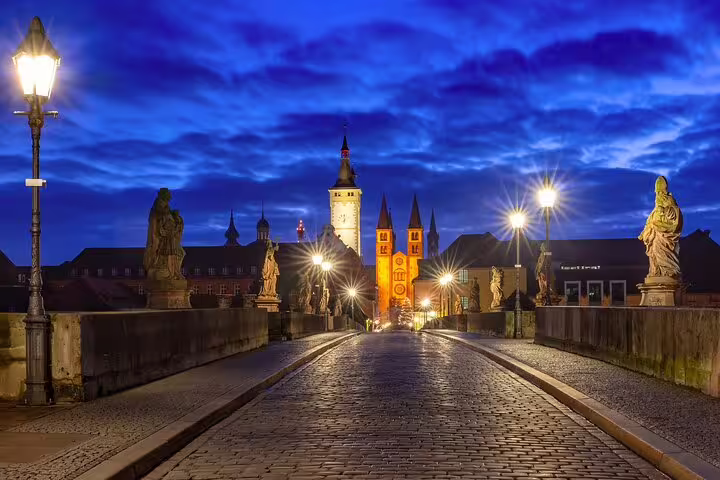 Old Main Bridge at night in Würzburg, Germany, perfect for a self-guided scavenger hunt walking tour