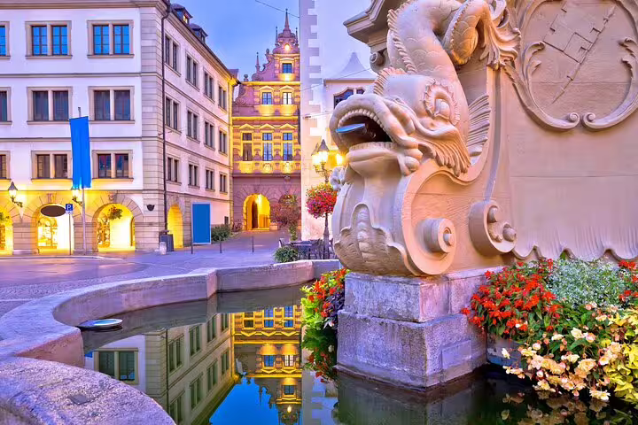 Würzburg Old Main Bridge fountain and historic buildings at dusk, highlight on a self-guided scavenger hunt