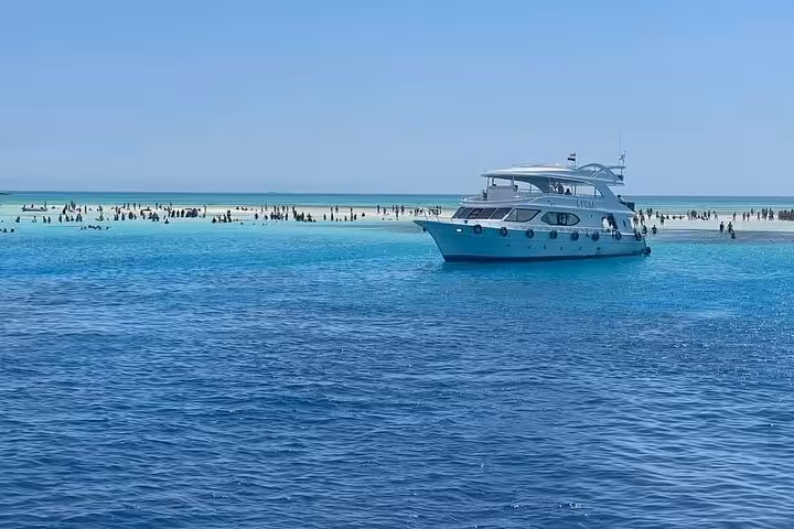 Yacht anchored at White Island sandbar on Ras Mohammed snorkeling trip from Sharm El Sheikh, Red Sea