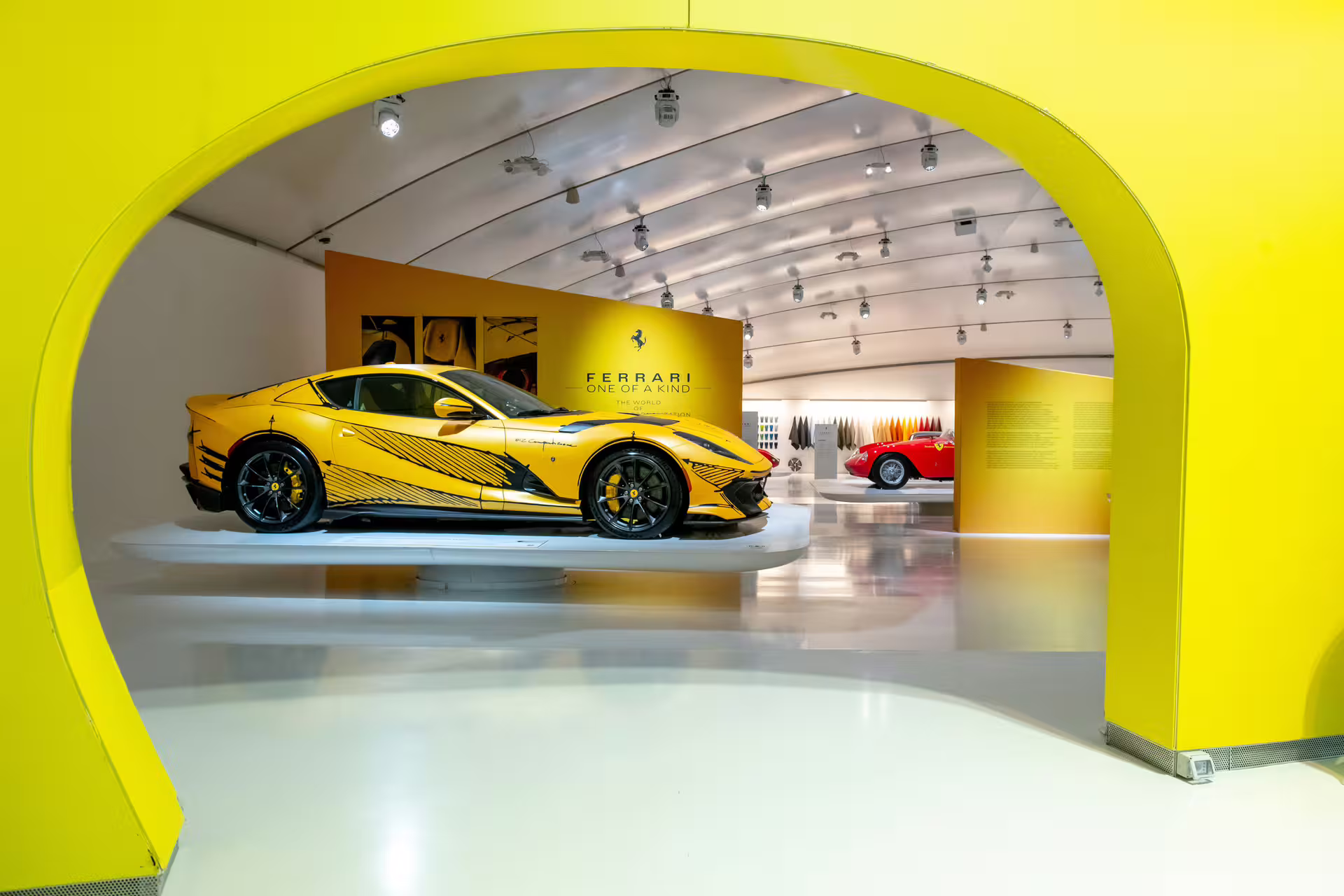 Yellow Ferrari supercar exhibit inside Enzo Ferrari Museum Modena, access with entrance ticket